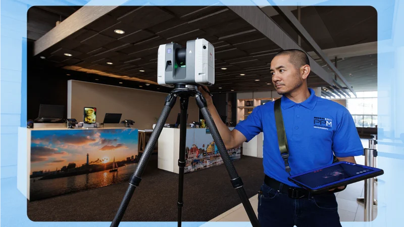 A Precision Property Measurements employee uses a Leica RTC 360 scanner to survey a hotel meeting area.