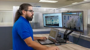 Image of a drafter using point cloud data to produce As-Built deliverables in Revit and AutoCAD.